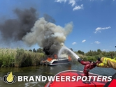 Schip in brand Oostkil in Hank