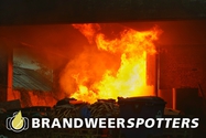 Gebouw in brand (middel brand) Heuvelstraat in Dongen